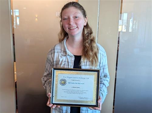 Kenmore West student Sierra Green smiles with an award give to her